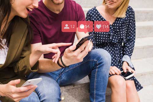 A man keeping a cell phone showing a SMS marketing message in to  